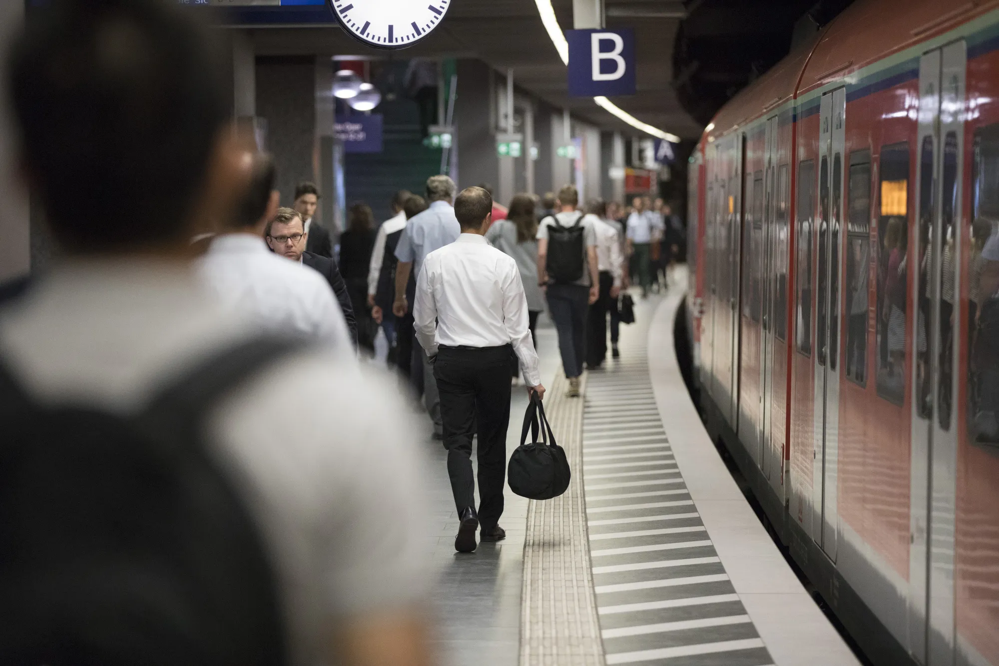 City workers walk on a platform during the morning rush hour commute at Taunusanlage S-Bahn underground railway station in Frankfurt, Germany, on Monday, Aug. 7, 2017. London could lose 10,000 banking jobs and 20,000 roles in financial services as clients move 1.8 trillion euros ($2.1 trillion) of assets out of the U.K. on Brexit, according to think-tank Bruegel.