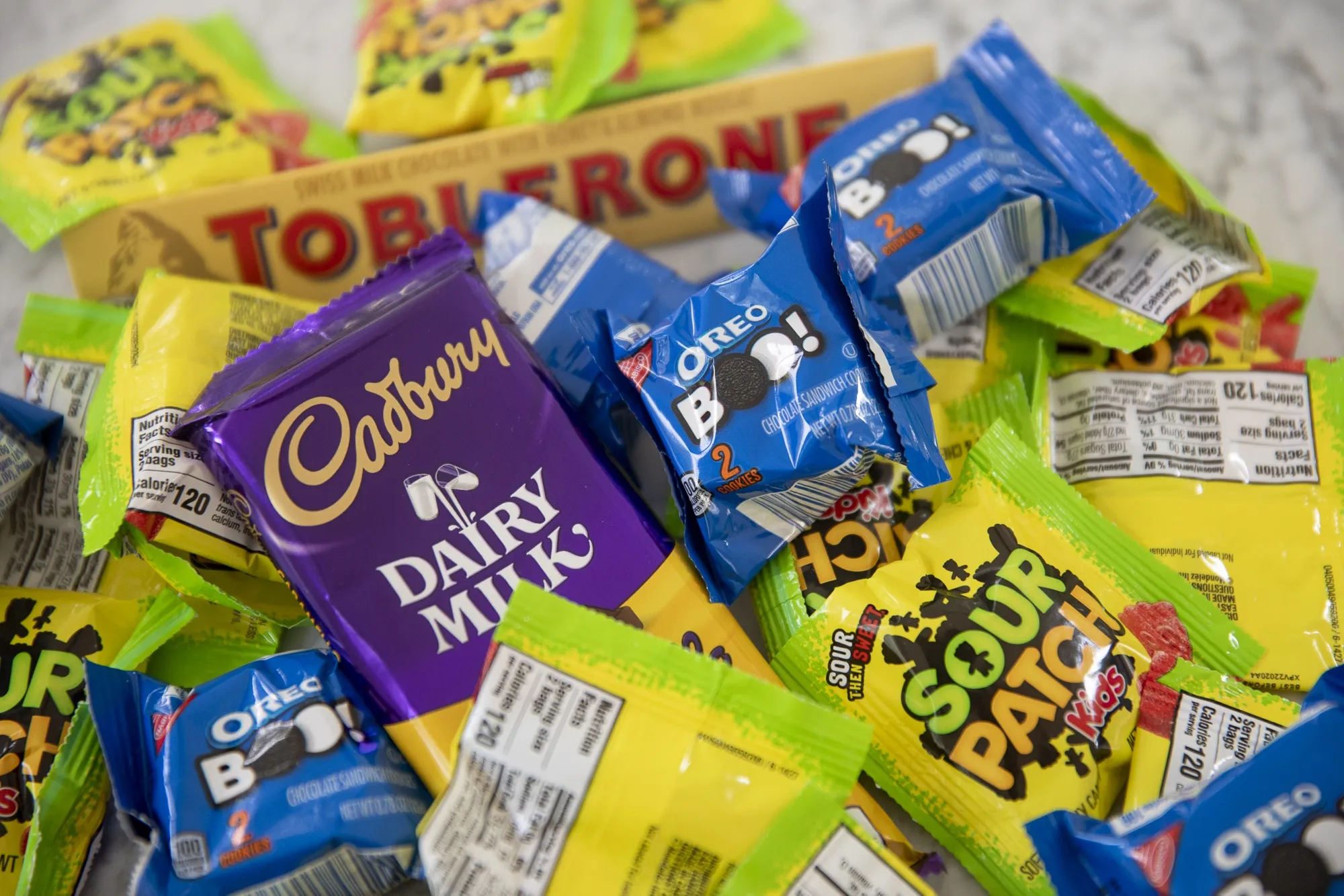 Mondelez International Inc. brand candies, including Sour Patch Kids, Oreos, and Cadbury chocolate.