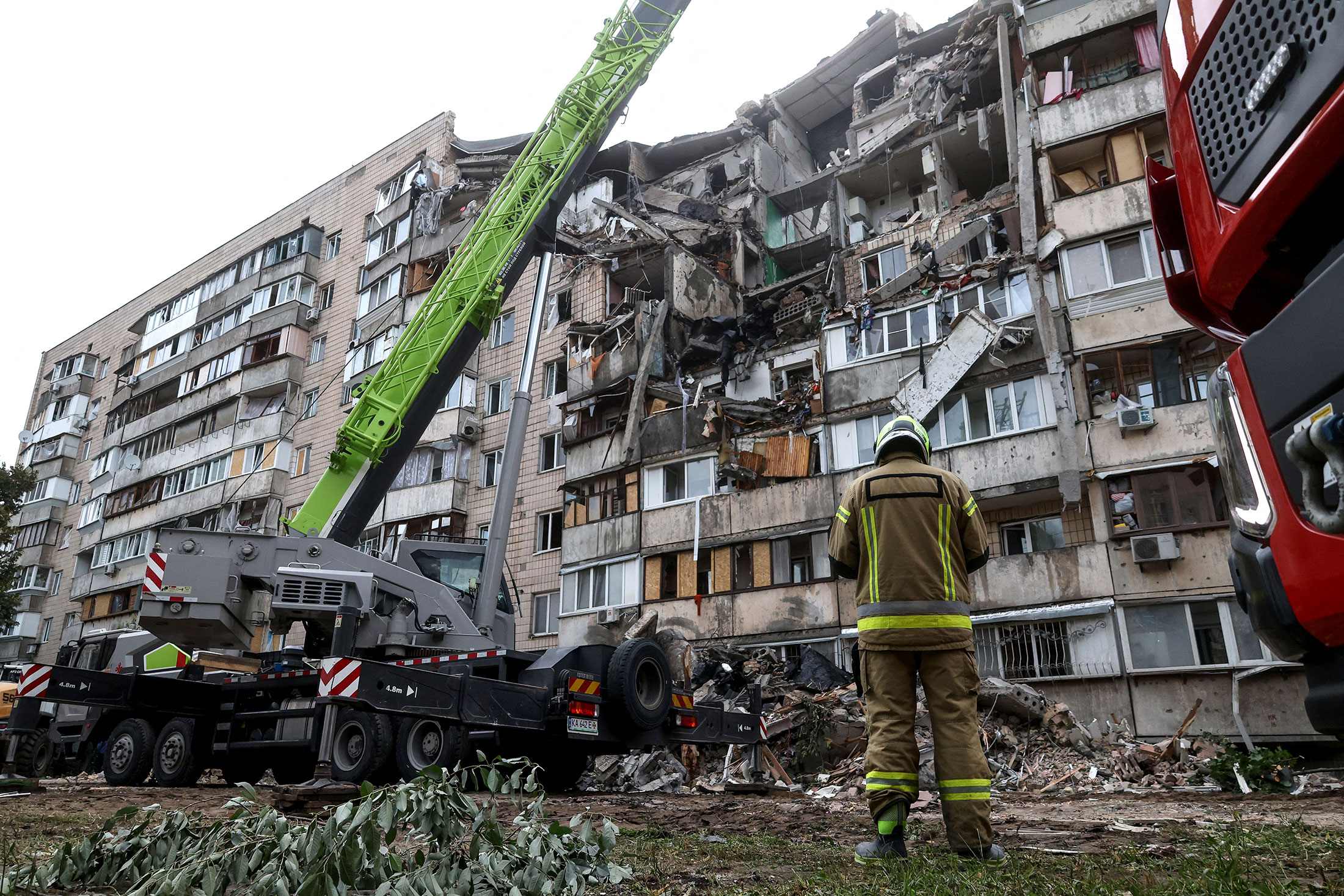 Emergency services work at the site of a Russian attack on an apartment building in Kyiv, on July 6 Photographer: Serhii Okunev/AFP/Getty Images