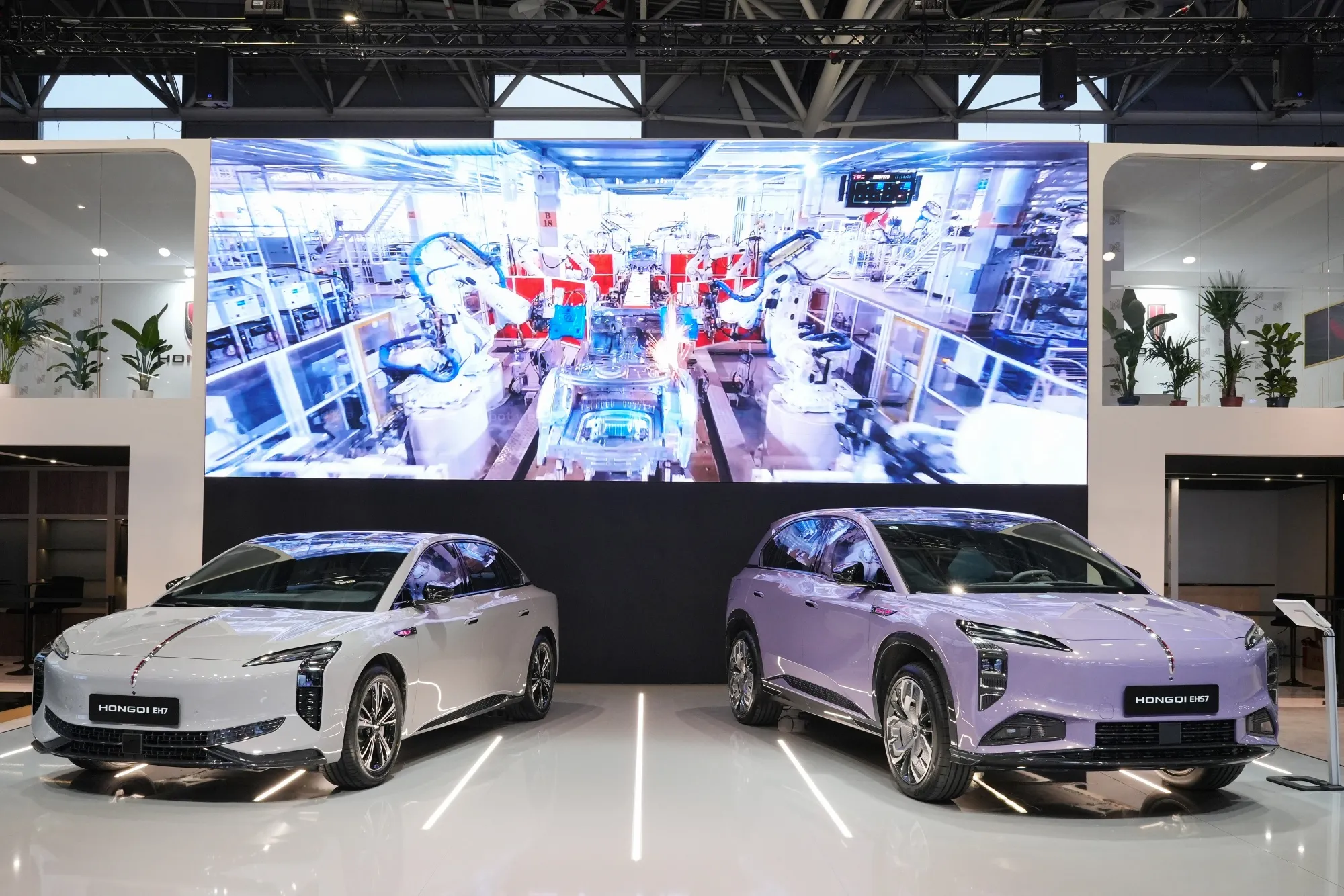 A Hongqi EH7, left, and a Hongqi EHS7 electric automobile, manufactured by China Faw Group.