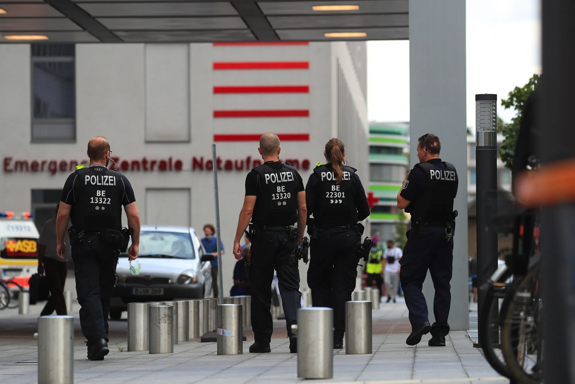 Police officers patrol outside the Charite Hospital in Berlin, Aug. 24.