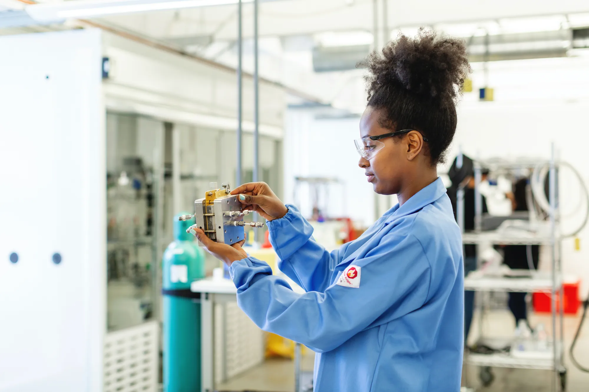 An OPUS engineer holds a reactor cell.