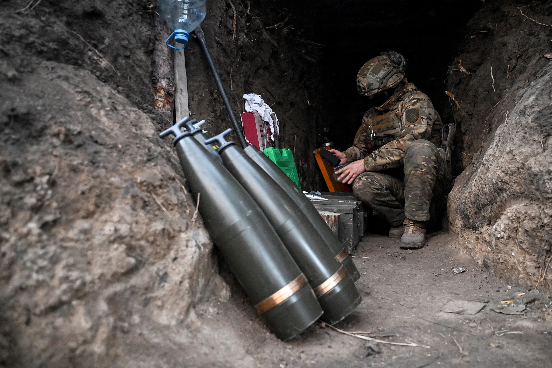 A soldier near 155mm artillery shells in the Zaporizhzhia region, Ukraine, on March 5.