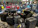 Suitcases are seen uncollected at Heathrow's Terminal Three bagage reclaim.