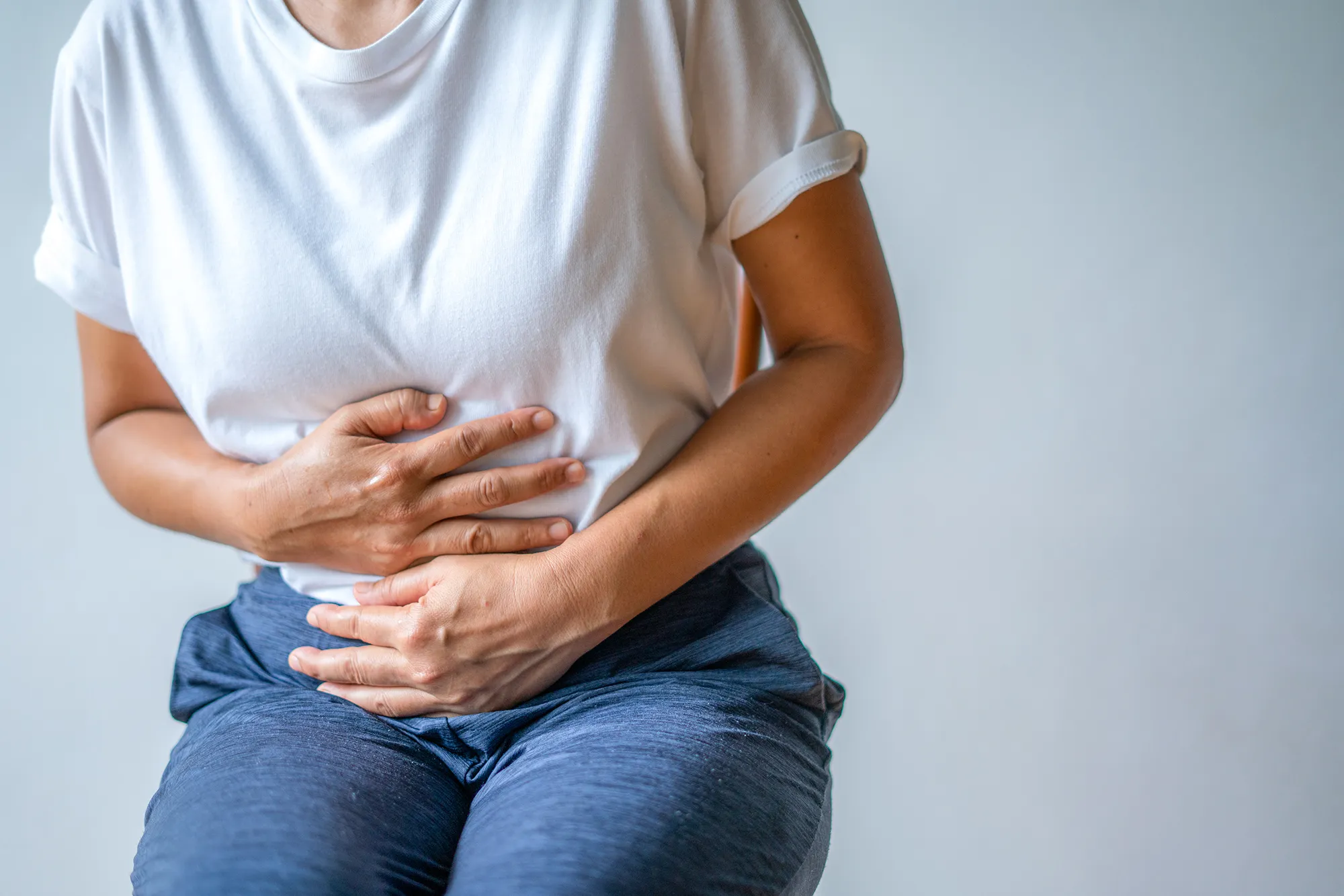 RF woman with stomach ache, menstrual period cramp, abdominal pain, food poisoning