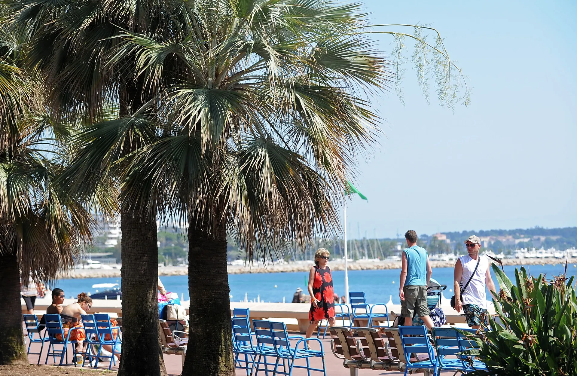 Pedestrians walk on the Promenade de la Croisette in Cannes, France, plus Transocean strikes $5.8 billion deal for Valaris.