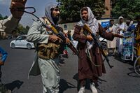 Taliban fighters patrol the streets in Kabul on Aug. 19. 
