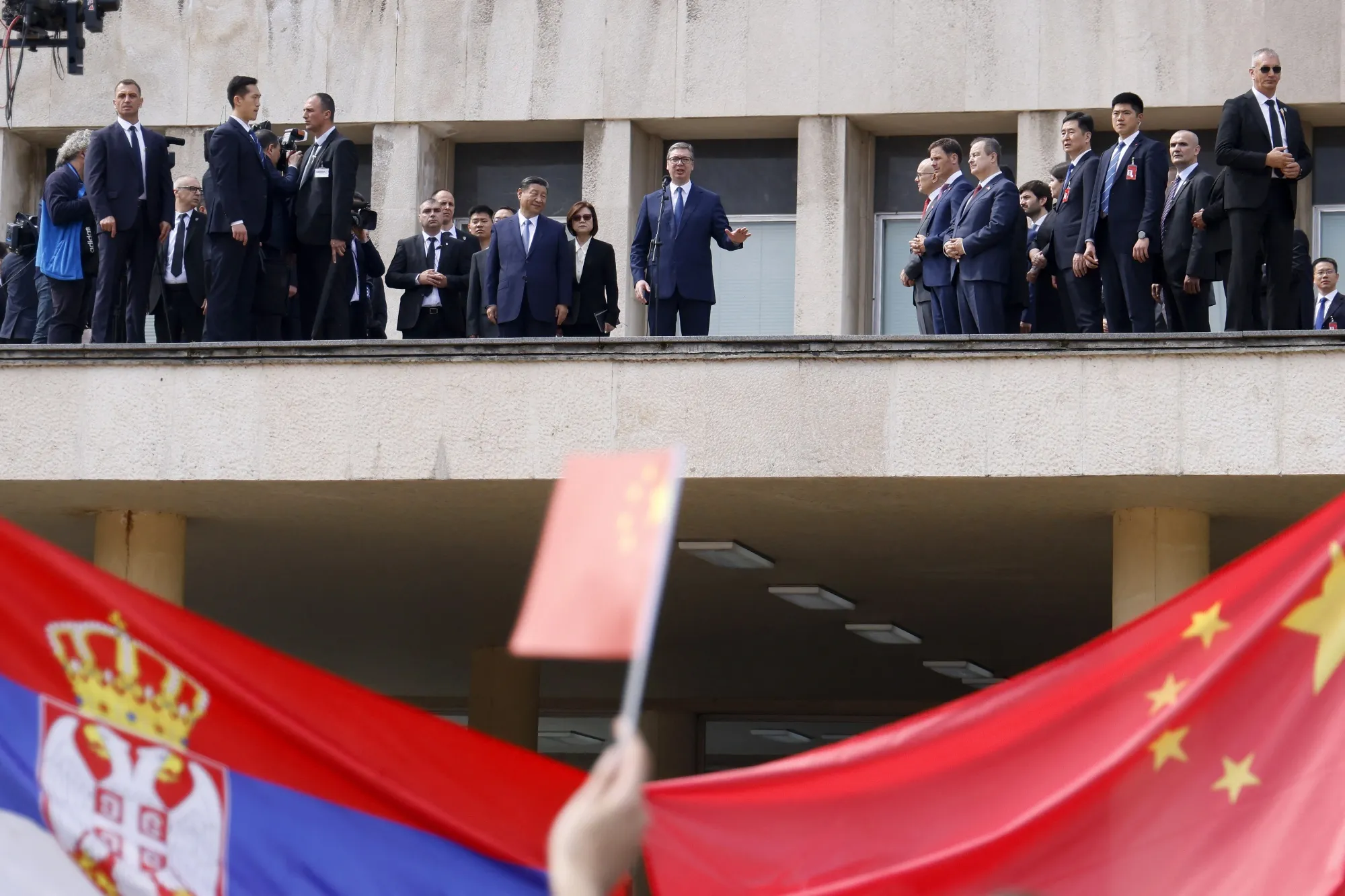 Aleksandar Vucic accompanied by Chinese President Xi Jinping addresses people gathered in front of the Palace of Serbia