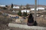Supporters of Israeli settlers gather in the settlement outpost of Amona, which was established in 1997, in the Israeli-occupied West Bank on Dec. 9, 2016.
