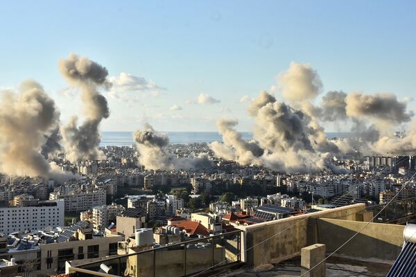 Smoke rises following Israeli strikes in southern Beirut, on Nov. 26.