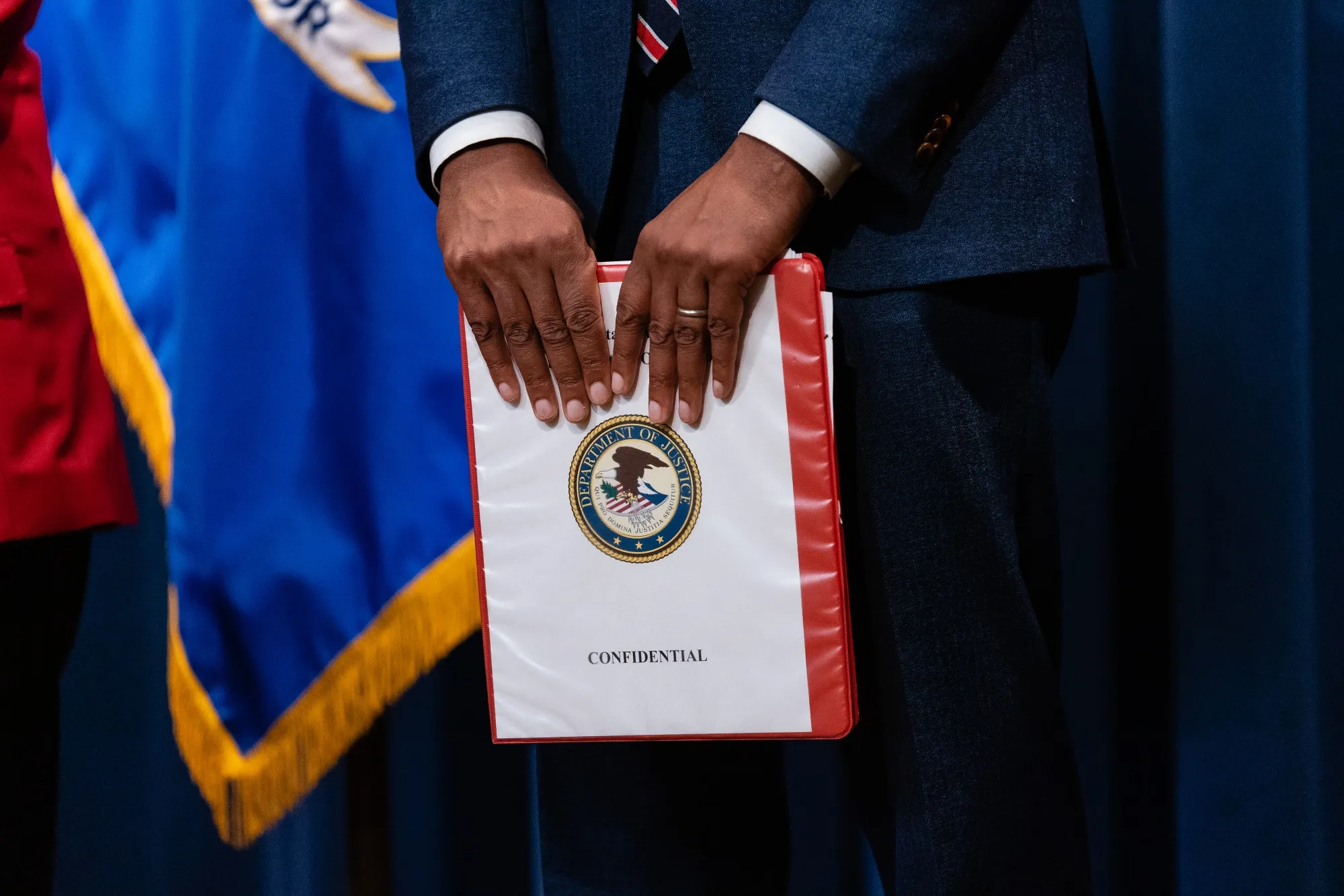 Damian Williams, then-US attorney for the Southern District of New York, holds a "confidential" binder during a news conference at the Department of Justice in Washington DC on&nbsp;April 14, 2023. The Justice Department announced charges against several leaders of the Sinaloa Cartel and its facilitators. The Organized Crime Drug Enforcement Task Forces were involved in the investigation and capture of the cartel’s leader, Joaquin “El Chapo” Guzman.