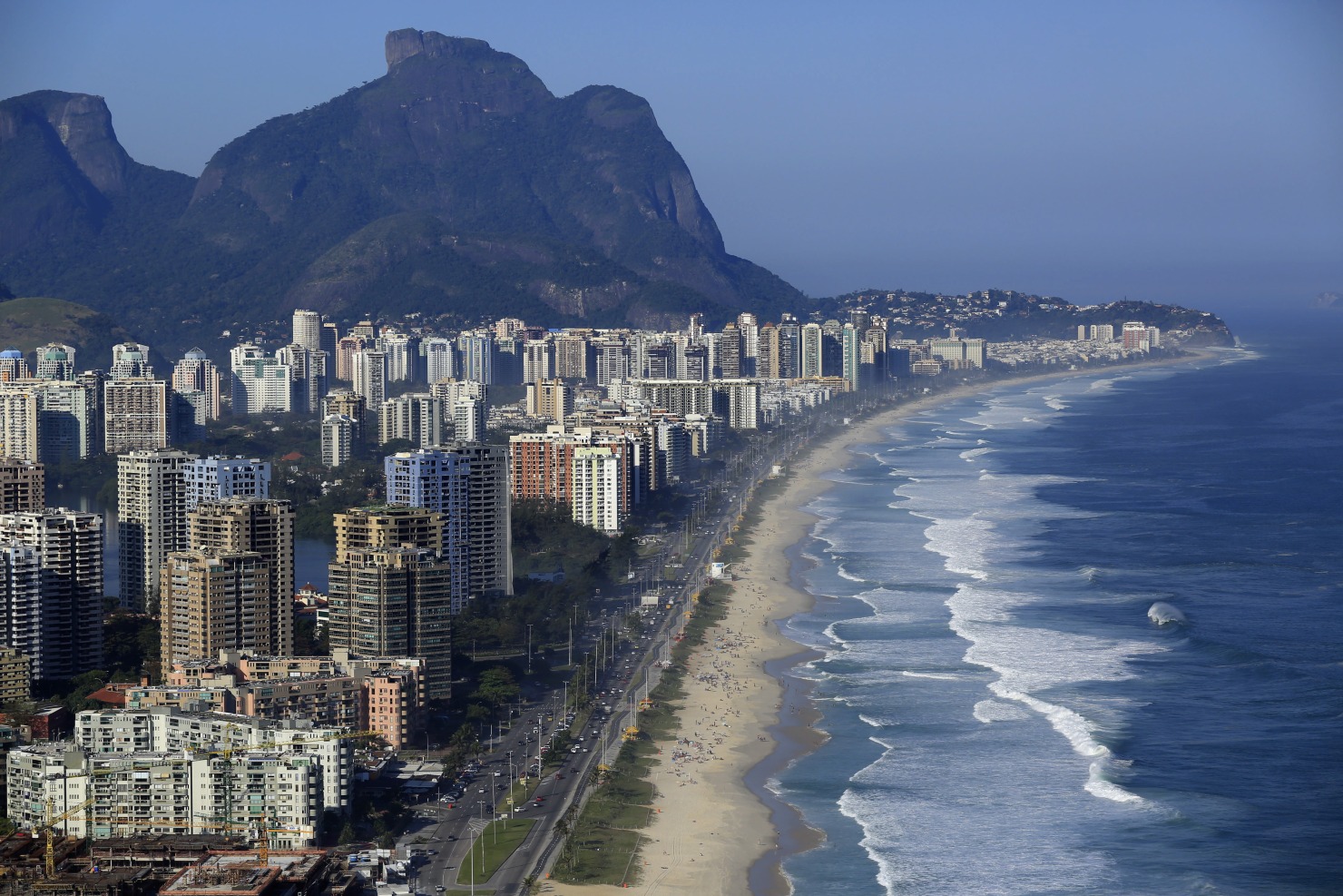 Buildings stand along the beach in the Barra da Tijuca neighborhood in Rio de Janeiro.