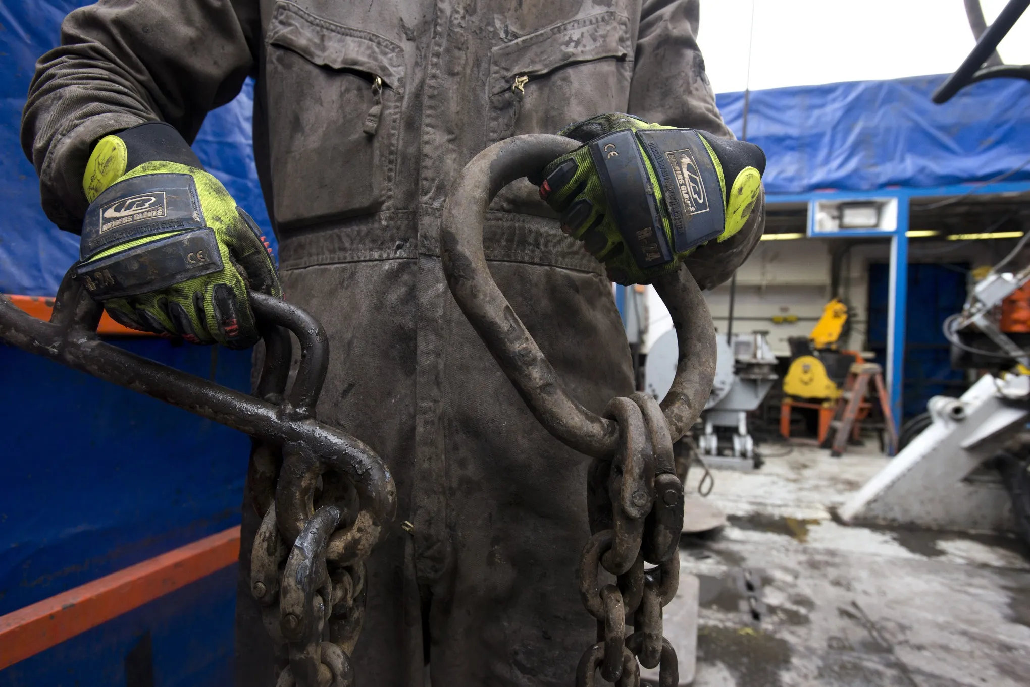 Rig hands move equipment at a hydraulic fracturing site owned by EQT Corp. located atop the Marcellus shale rock formation.