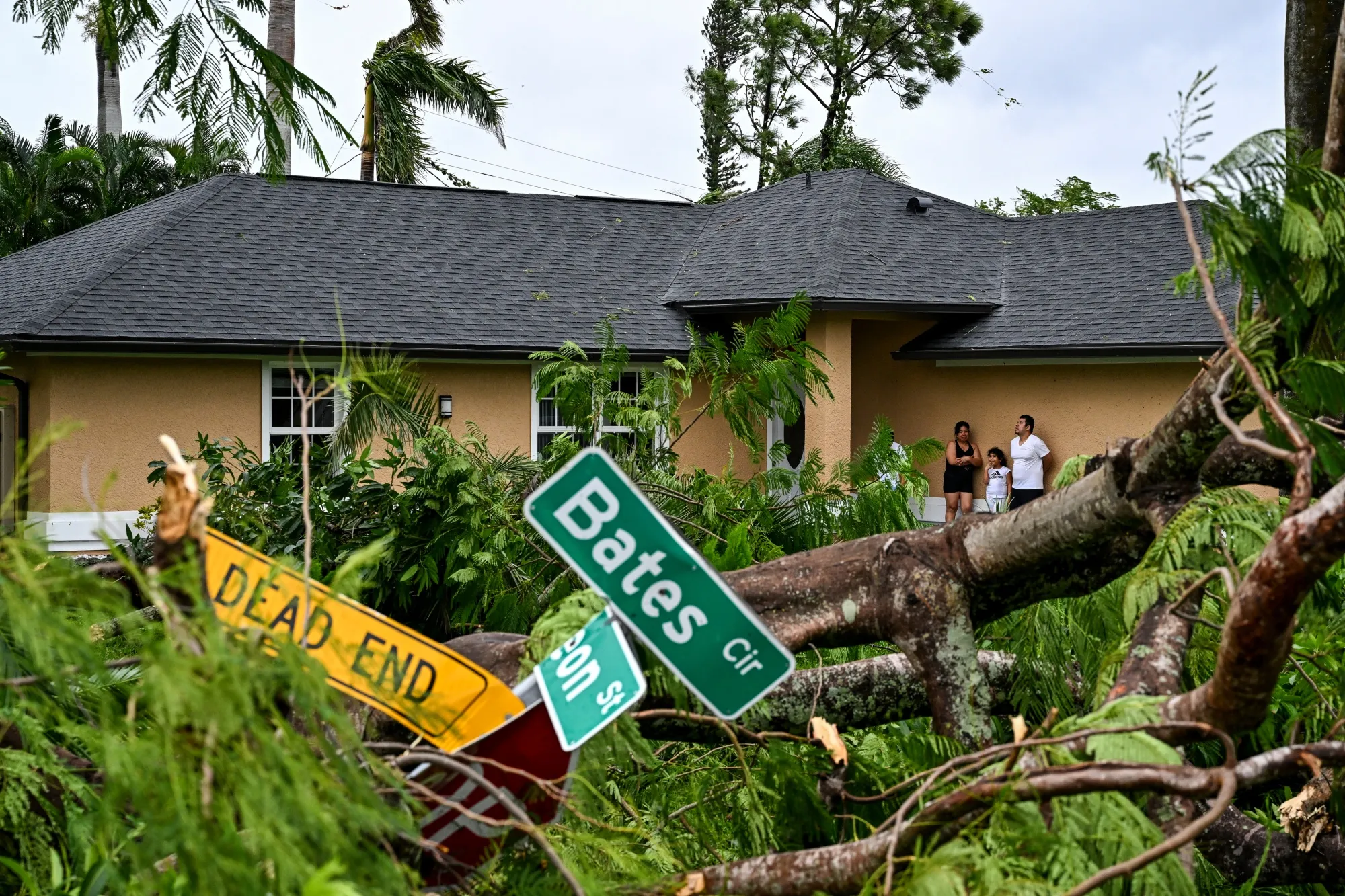 Debris in front of a home following a tornado in Fort Myers, Florida, on Oct. 9