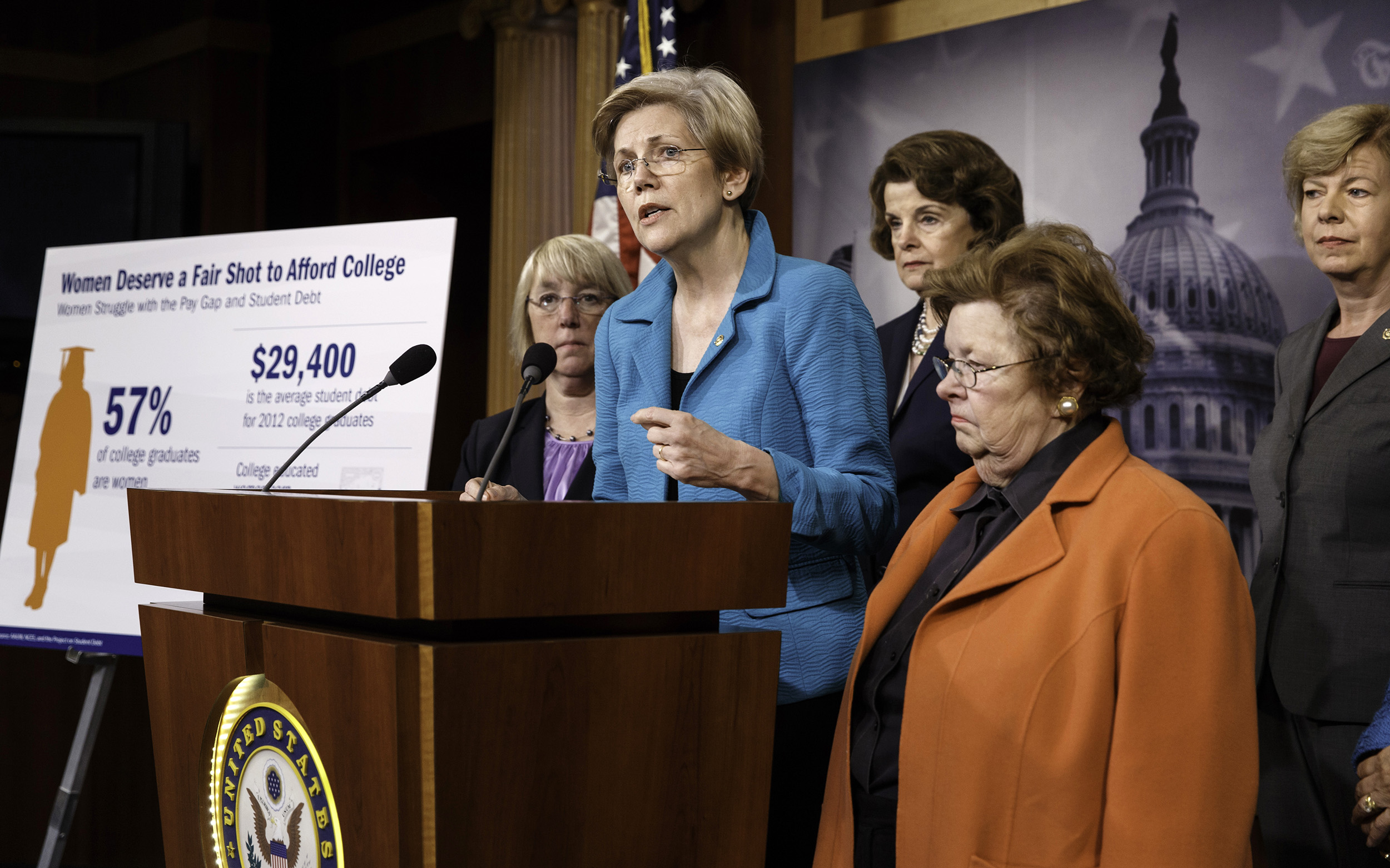 Senator Elizabeth Warren (D-Mass.), center, joined by other women of the Senate, holds a news conference on her bill, the Bank on Students Emergency Loan Refinancing Act, which would allow people with outstanding student loan debt to refinance at the lower interest rates currently offered to new borrowers, on June 4, 2014, on Capitol Hill.
