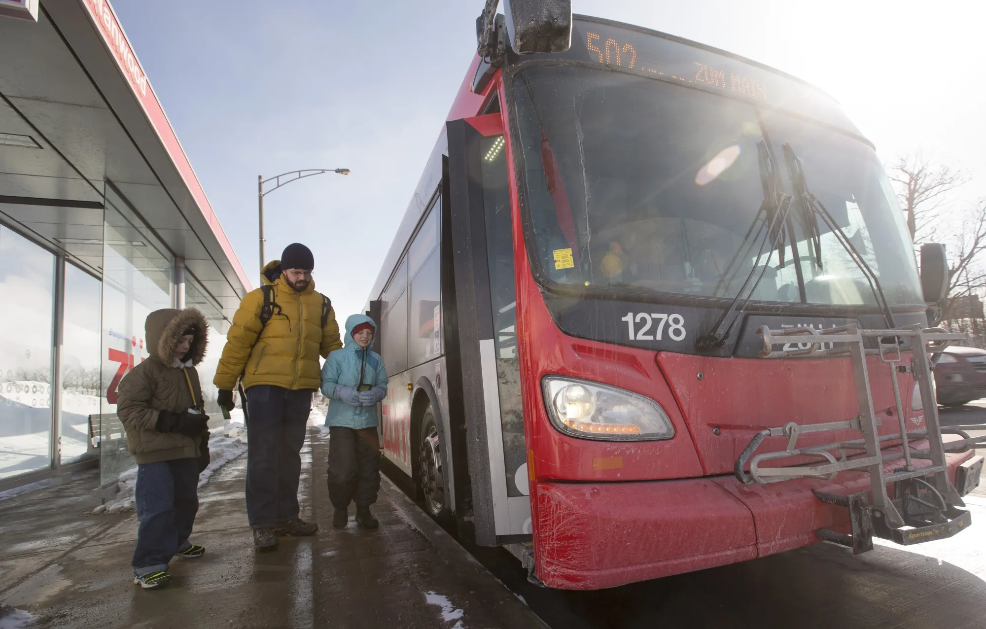 A Brampton family gets on the bus in 2015.