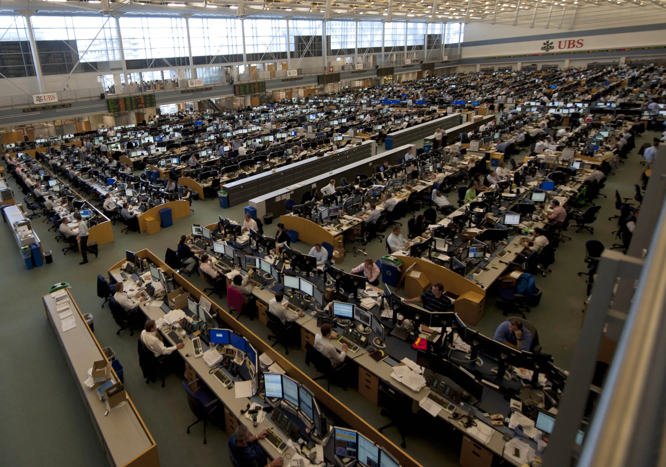 People work on the UBS trading floor in Stamford, Connecticut, on Aug. 23, 2011.
