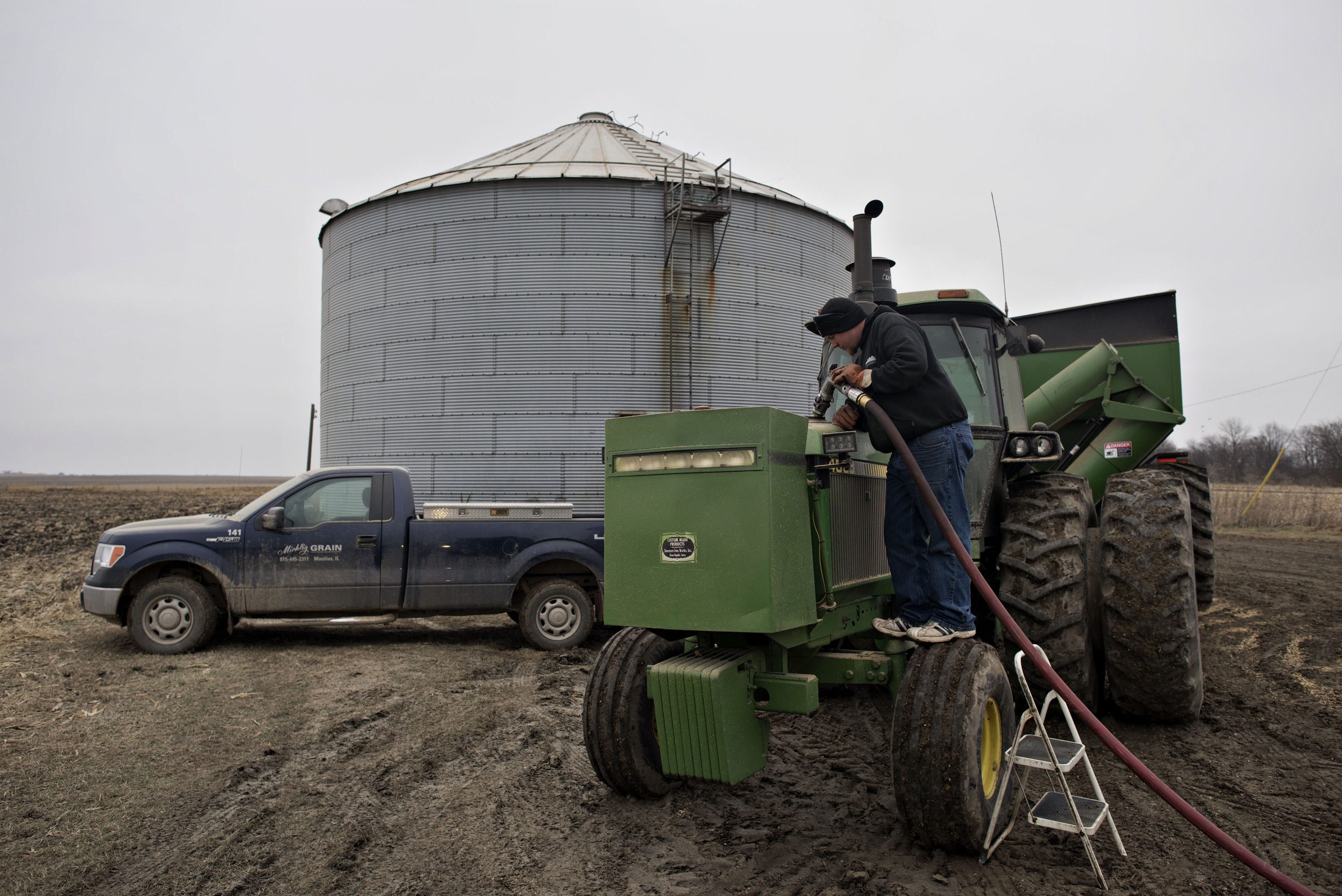 A worker delivers diesel fuel to a tractor in Manlius, Illinois.