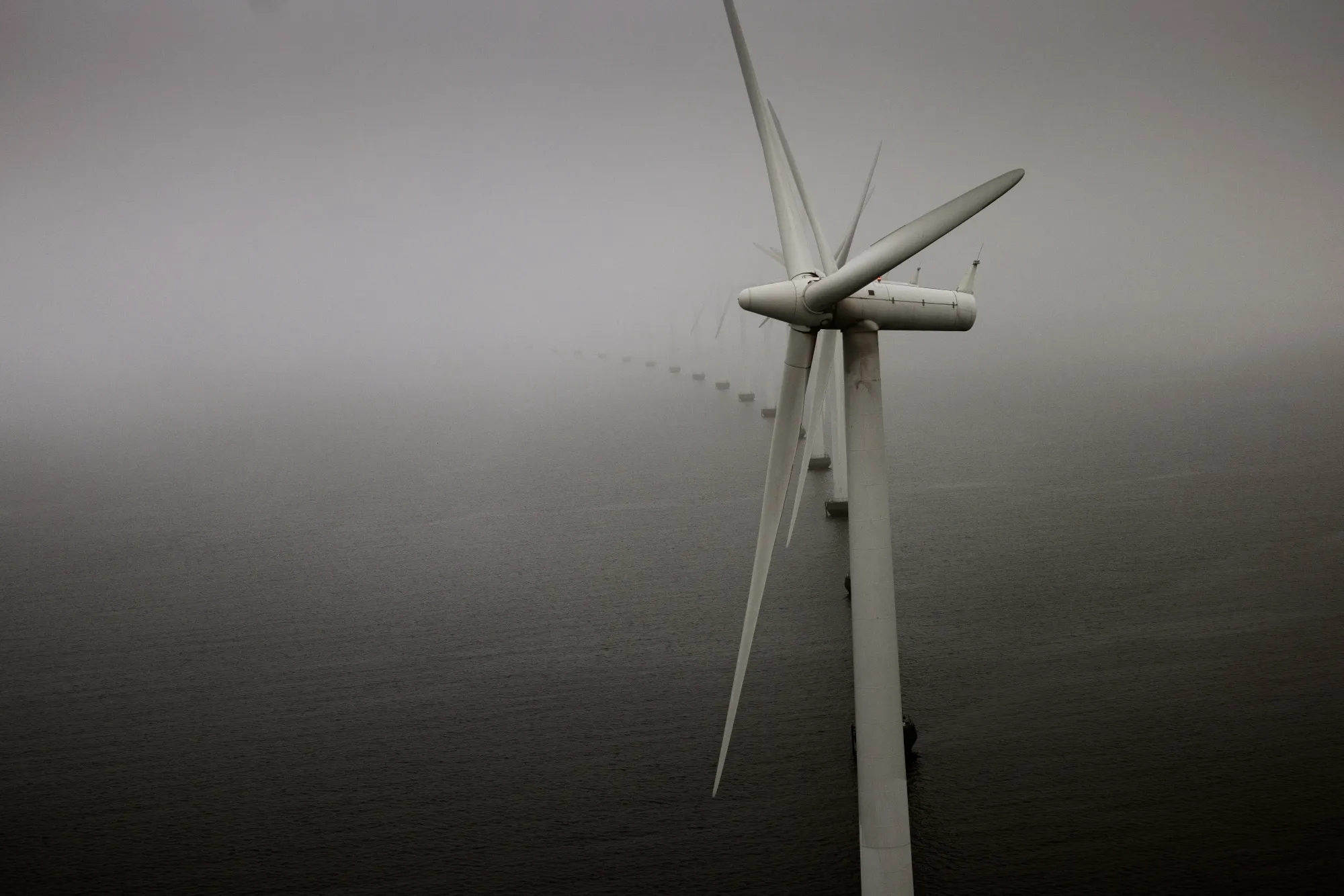 Offshore wind turbines at the Middelgrunden wind farm off the coast of Copenhagen, Denmark.