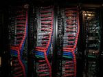 Data wires lead to servers on one of the cloud racks inside pod two of International Business Machines Corp.'s (IBM) Softlayer data center in Dallas.
