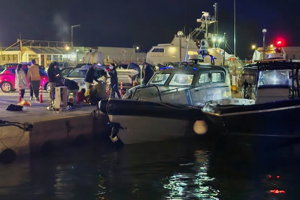 Coast guard officers carry out rescue operations at a port on the island of Chios, Greece, on Feb. 3.