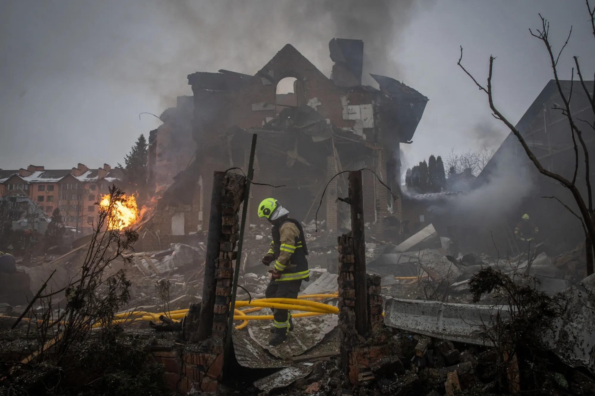 First responders work at the site of a Russian attack&nbsp;in the Sofiivska Borshchahivka suburb of Kyiv on Feb. 22.&nbsp;