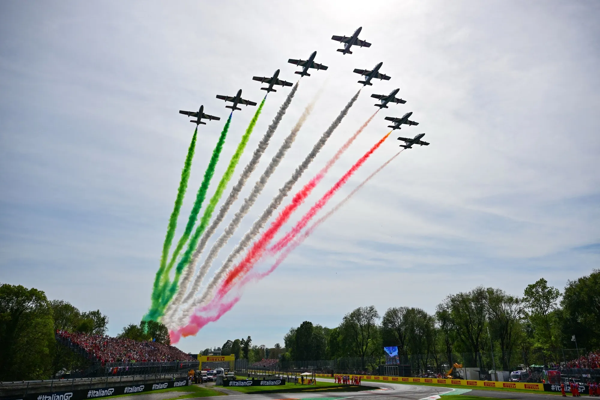 Italian air force jets fly over the Autodromo Nazionale Monza circuit leaving traces to the colors of the Italian flag prior to the start of the Italian Formula One Grand Prix race.