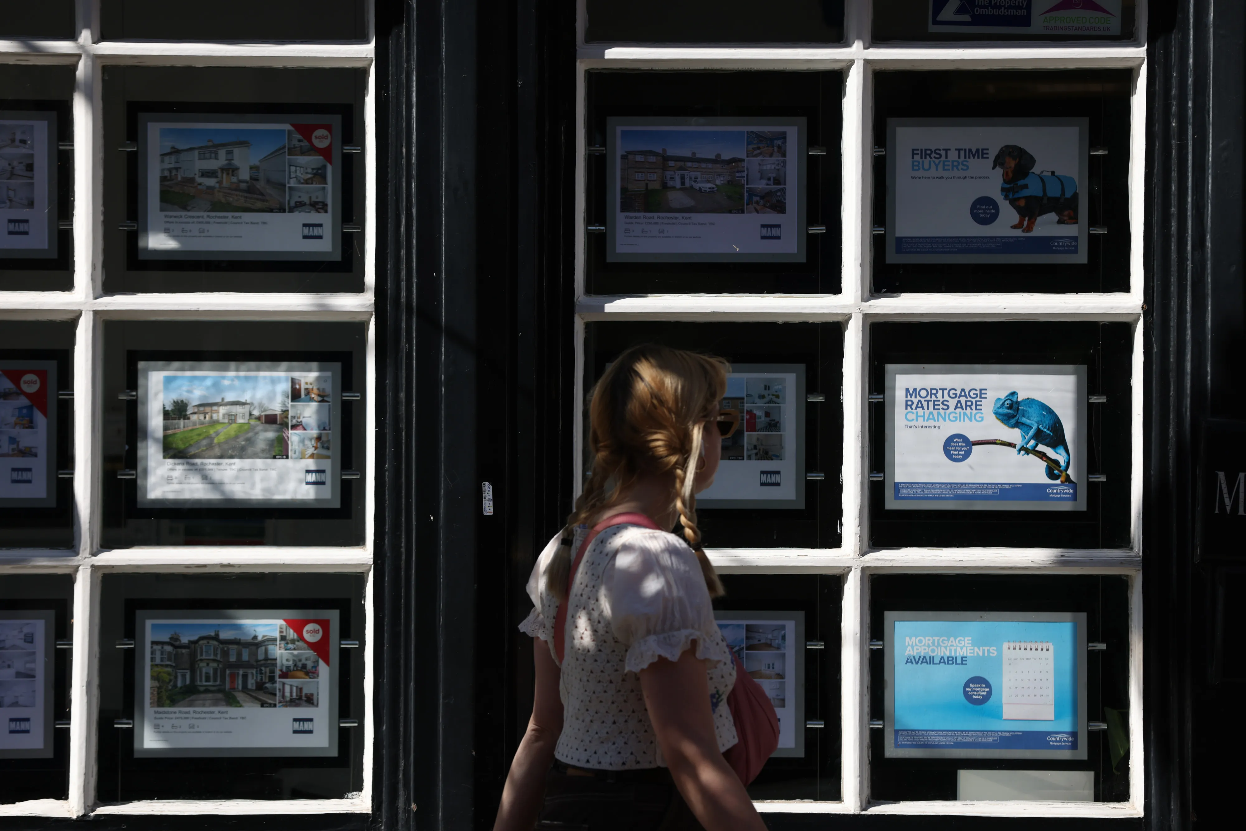 Properties advertised in the window of an estate agent in Rochester, UK.