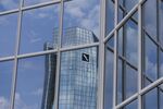 The twin tower skyscraper headquarters of Deutsche Bank AG are reflected in the windows of a neighboring office block in Frankfurt, Germany, on Wednesday, July 25, 2018. Deutsche Bank vowed to maintain its position in fixed-income trading after recording its weakest second quarter in that business since the global financial crisis, as Chief Executive Officer Christian Sewing accelerates the lender’s turnaround effort.