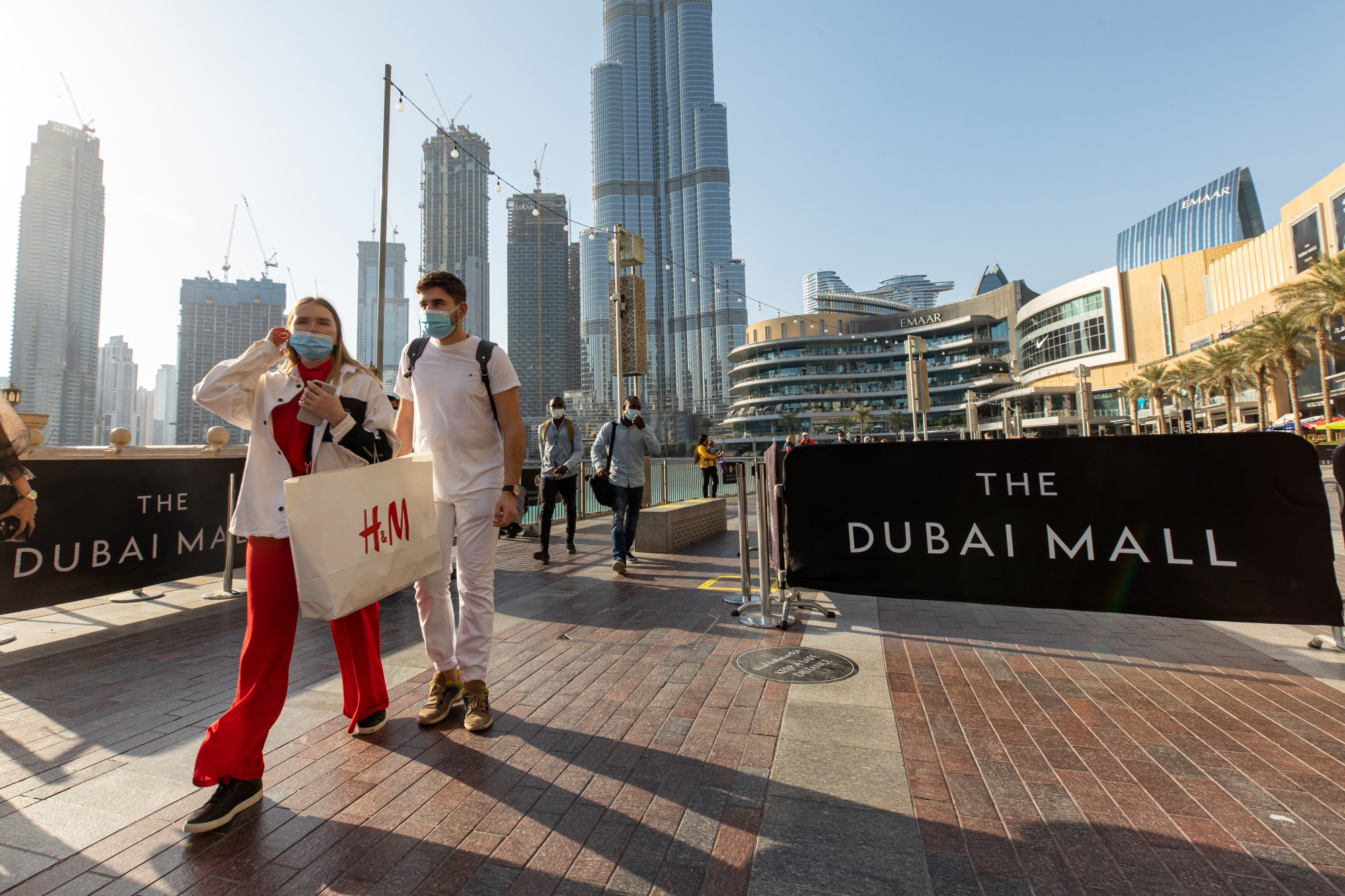 Shoppers near the Dubai Mall and the Burj Khalifa skyscraper in Dubai, on Jan. 27.