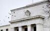 Birds fly past the Marriner S. Eccles Federal Reserve Board building in Washington, D.C., U.S.