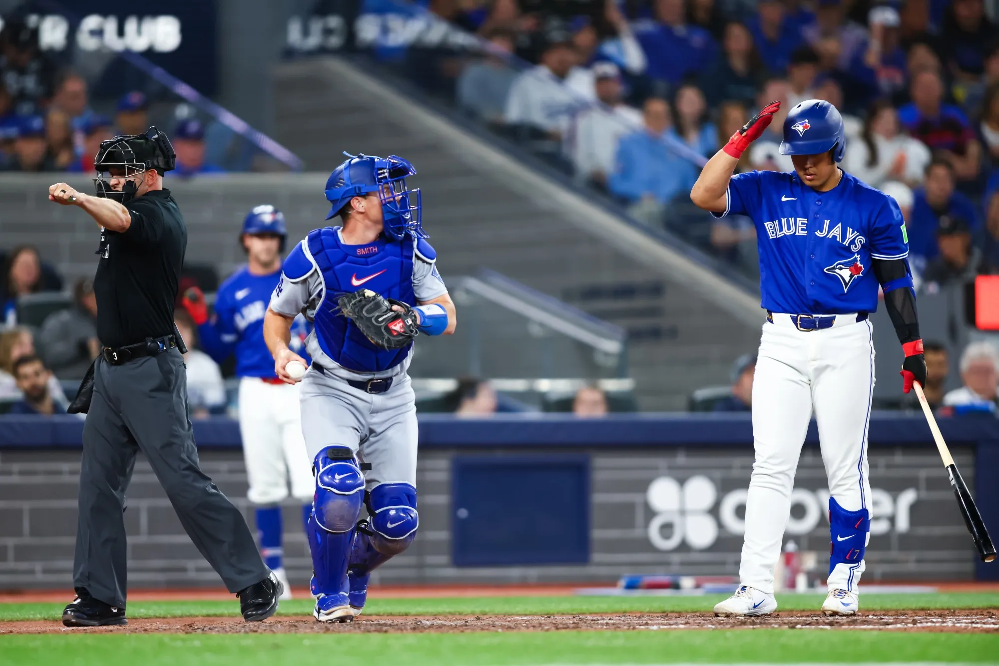 Kazuma Okamoto of the Toronto Blue Jays calls for an ABS challenge of a strikeout against the Los Angeles Dodgers in Toronto on April 7. Okamoto had his challenge upheld and then hit a double.