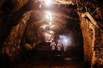 Miners walk through an underground tunnel at the South Deep gold mine, operated by Gold Fields, in Westonaria, South Africa.
