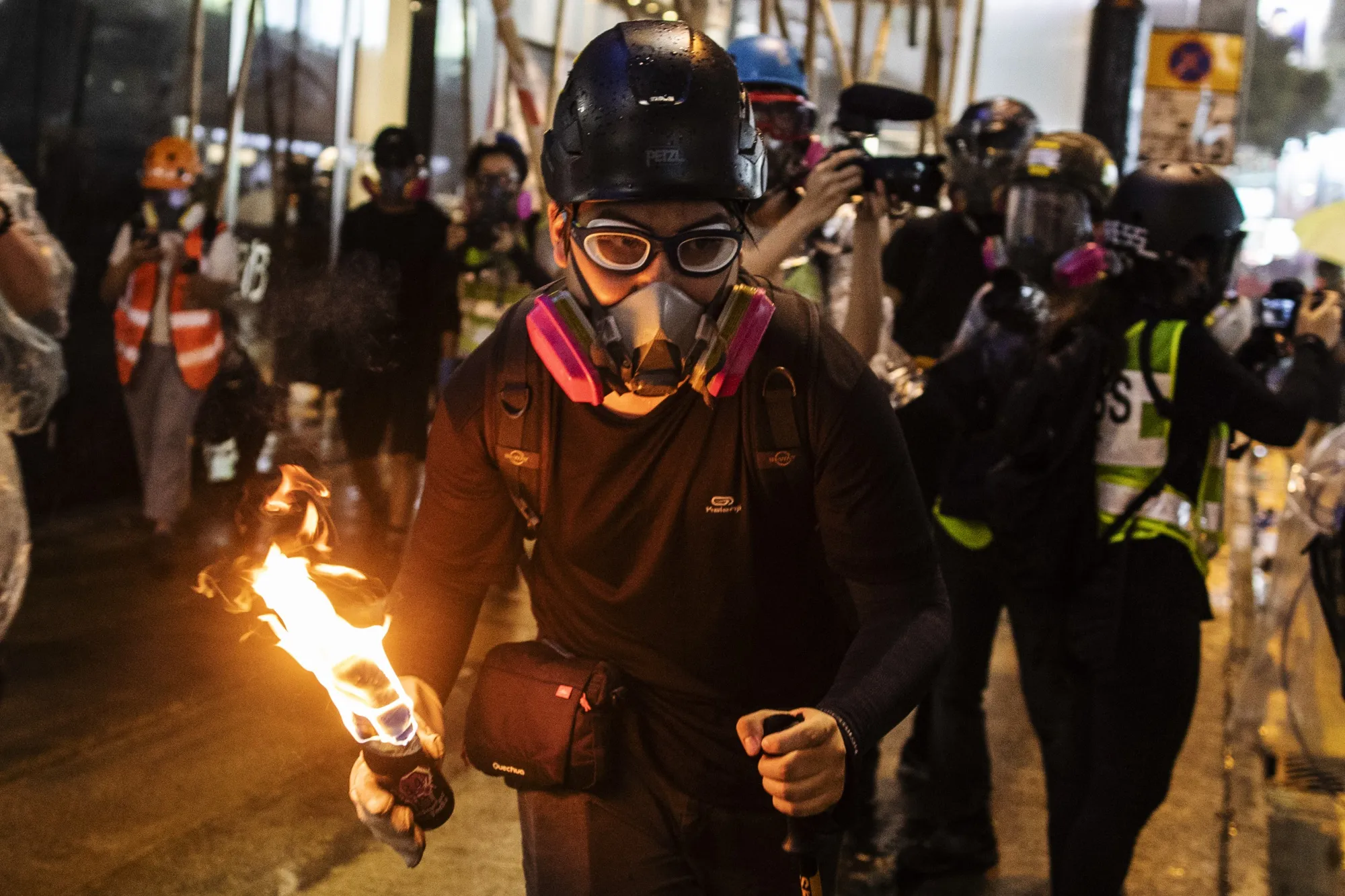 A demonstrator prepares to throw a petrol bomb during protests in Hong Kong.