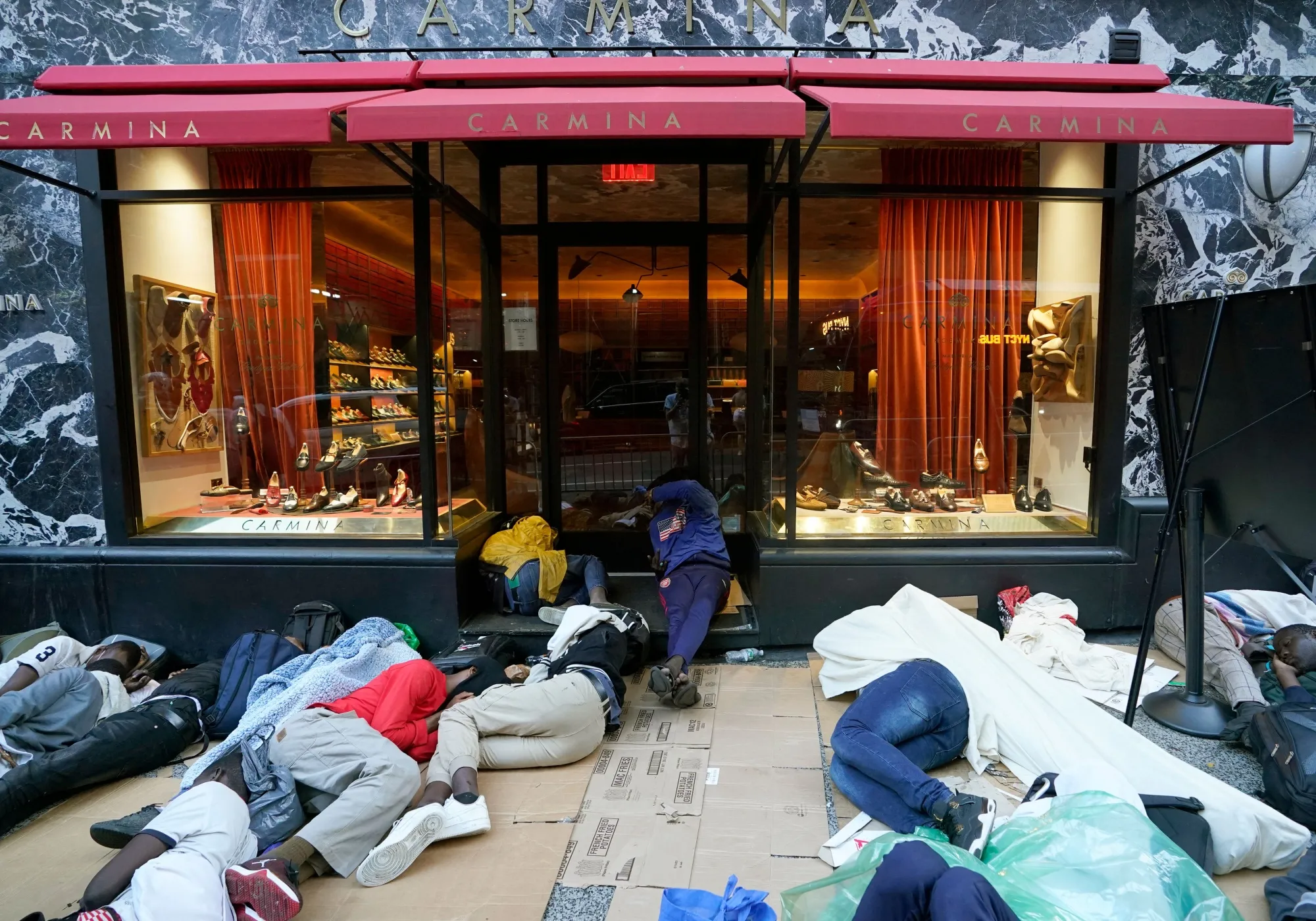 Migrants sleep outside the Roosevelt Hotel&nbsp;in New York.