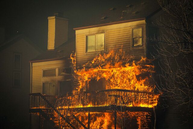A home burns after a fast moving wildfire swept through the area in the Centennial Heights neighborhood of Louisville, Colorado on December 30, 2021