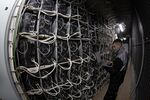 An engineer runs diagnostic tests at a cryptocurrency mining farm in Norilsk, Russia.