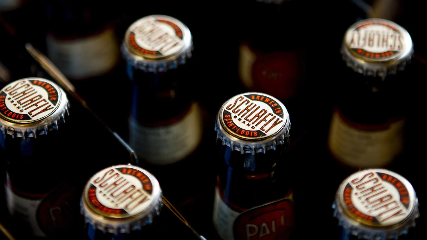 Bottles of Schlafly Pale Ale are packaged at Schlafly Bottleworks Brewery in St. Louis, Missouri, U.S., on Wednesday, Nov. 10, 2010. Drinking Budweiser in St. Louis used to be like driving a Ford or Chrysler in Detroit. Now, generations of local loyalty is eroding in the wake of InBev’s hostile takeover of Anheuser-Busch two years ago.
