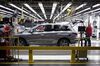 Workers perform final inspections on a vehicle at the Nissan Motor Co. manufacturing facility in Smyrna, Tennessee, U.S.