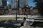 A person uses a mobile phone in the Marunouchi District of Tokyo, Japan, on Friday, Aug. 28, 2020.
