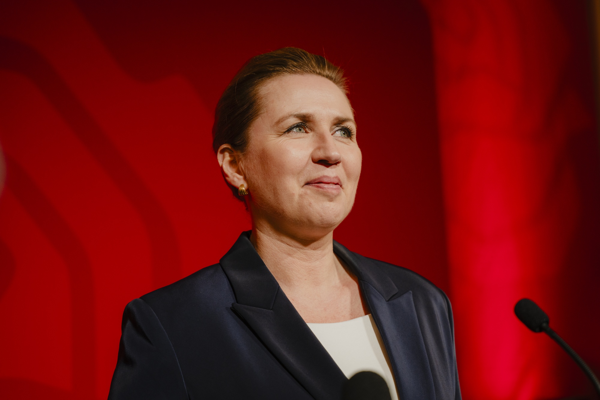 Mette Frederiksen, leader of the Social Democrats, speaks at their party's election night event at the Parliament in Copenhagen, Denmark, on Tuesday, March 24, 2026. Frederiksen's party won a closely contested election by pledging stability in global turmoil, setting the stage for difficult coalition talks to secure a third term in power. Photographer: Nichlas Pollier/Bloomberg
