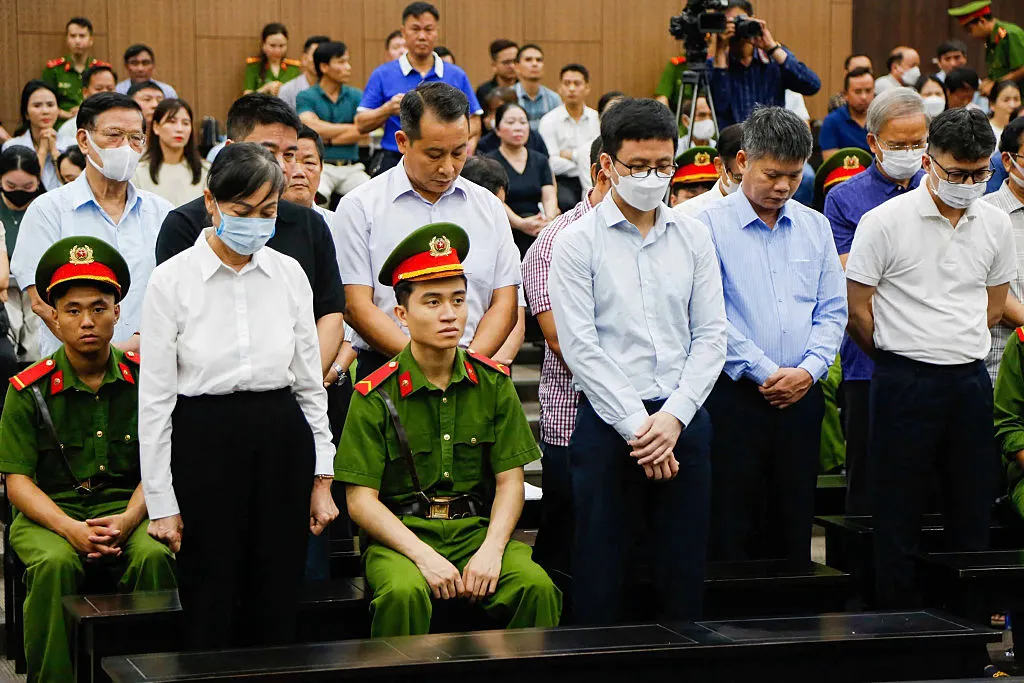 Hoang Thi Thuy Lan&nbsp;stands with other defendents during a corruption trial in the People's Court in Hanoi, on July 11.
