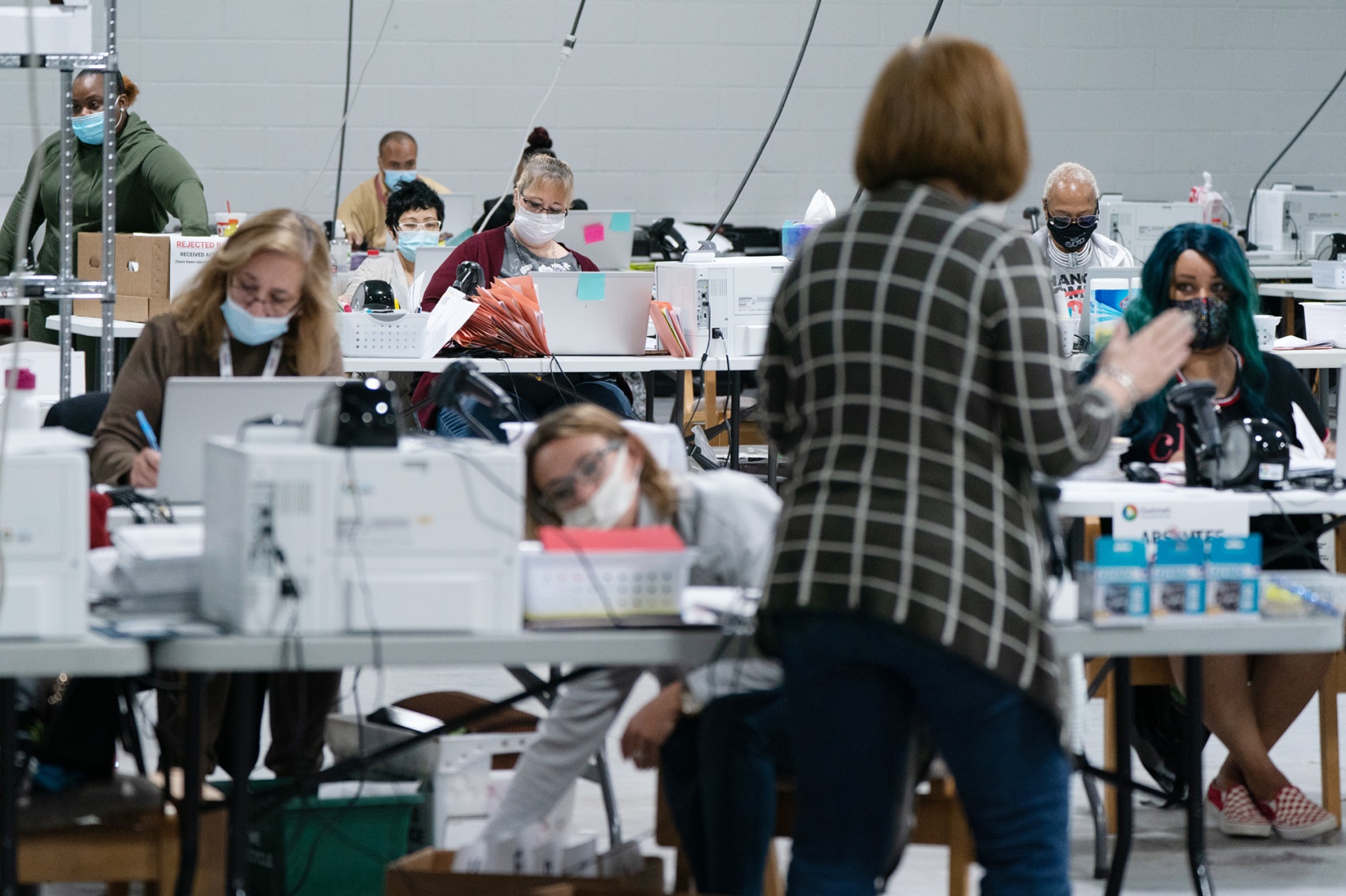 Election officials check ballots in Lawrenceville, Georgia, on Saturday.