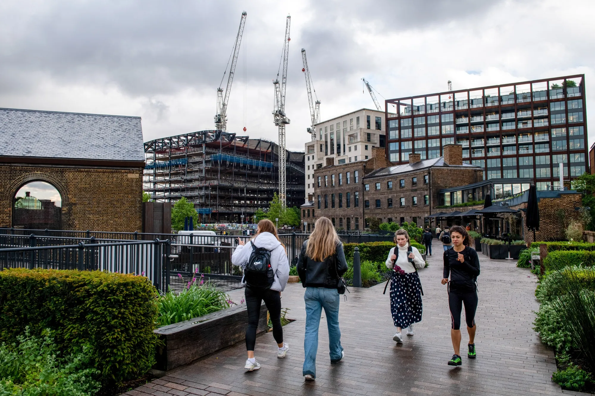 People walk through Coal Drops Yard in London, on May 11.&nbsp;
