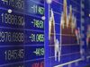 The Shanghai Stock Exchange Composite Index, center, is displayed on an electronic stock board outside a securities firm in Tokyo, Japan, on Wednesday, Jan. 20, 2016. Japanese stocks plunged into a bear market amid a slump in equities across Asia as investor concerns over the global economic outlook outweighed technical signs that a China-fueled rout has gone too far.