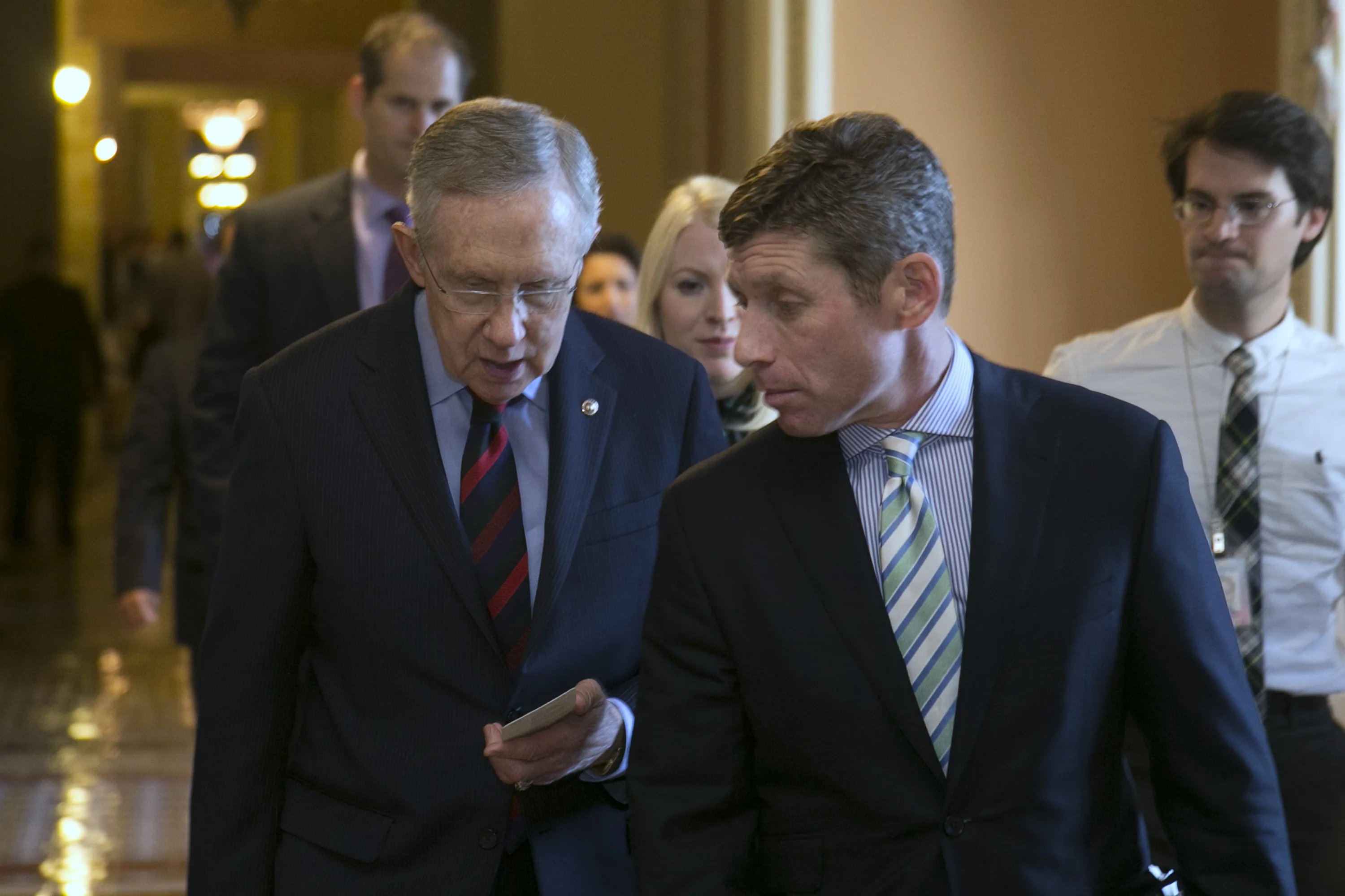 Senator Harry Reid, a Democrat from Nevada and Senate majority leader, left, talks to David Krone, Reid's chief of staff, following a meeting at the U.S. Capitol on Sept. 12, 2013.
