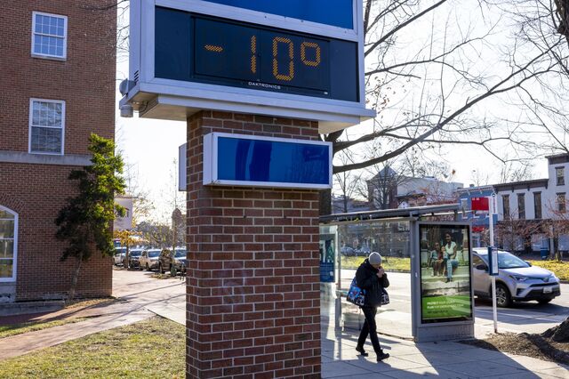 A person walks down Pennsylvania Avenue, in Washington, DC, in the morning during the bitterly cold weather on Dec. 24, 2022