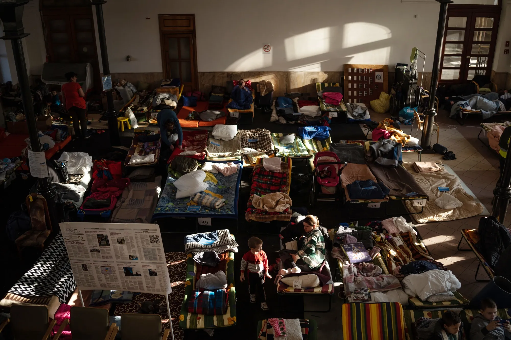 Displaced Ukrainians rest at a temporary shelter set up in the former Krakov Main railway station building on March 13.
