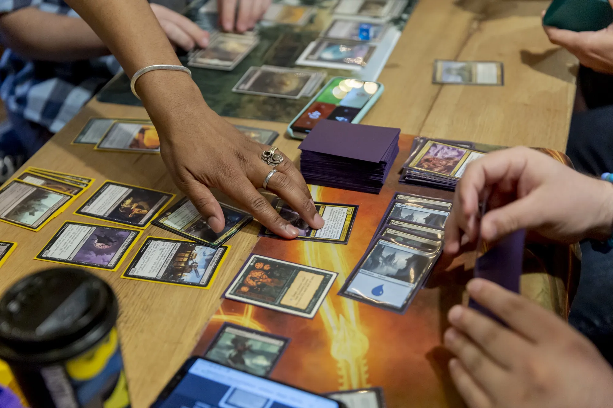 Participants play the Magic: The Gathering card game at a shop in New York.