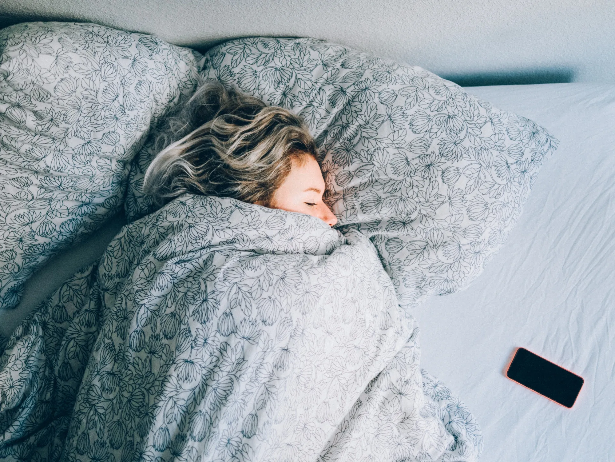 A woman sleeping in a brightly lit room.&nbsp;
Adam Kuylenstierna /EyeEm/Getty Images